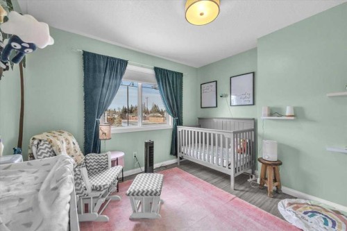 301 Mcleod Crescent, Diamond Valley, AB - Indoor Photo Showing Bedroom