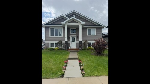301 Mcleod Crescent, Diamond Valley, AB - Outdoor With Facade