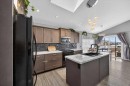 301 Mcleod Crescent, Diamond Valley, AB  - Indoor Photo Showing Kitchen With Double Sink With Upgraded Kitchen 