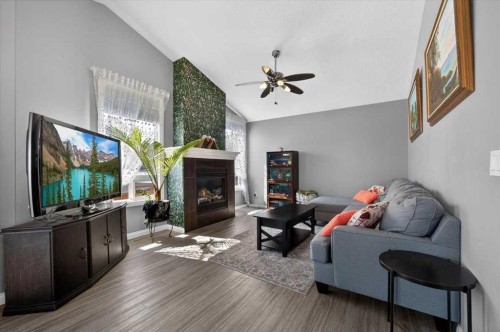301 Mcleod Crescent, Diamond Valley, AB - Indoor With Fireplace
