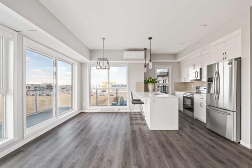 409-4350 Seton Drive Se, Calgary, AB - Indoor Photo Showing Kitchen With Upgraded Kitchen