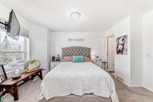 15 Spring Meadows Bay, Okotoks, AB - Indoor Photo Showing Bedroom