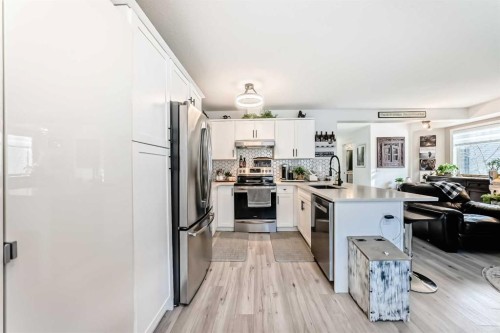 15 Spring Meadows Bay, Okotoks, AB - Indoor Photo Showing Kitchen With Stainless Steel Kitchen