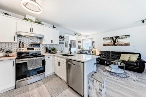 15 Spring Meadows Bay, Okotoks, AB - Indoor Photo Showing Kitchen With Stainless Steel Kitchen