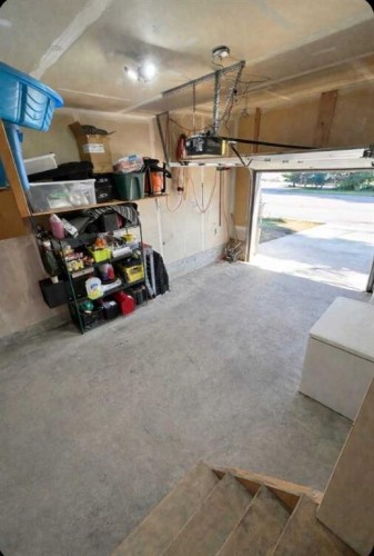 15 Spring Meadows Bay, Okotoks, AB - Indoor Photo Showing Garage