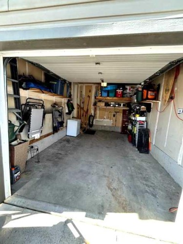 15 Spring Meadows Bay, Okotoks, AB - Indoor Photo Showing Garage