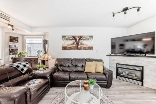 15 Spring Meadows Bay, Okotoks, AB - Indoor Photo Showing Living Room With Fireplace