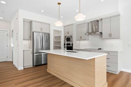 305 Precedence View, Cochrane, AB - Indoor Photo Showing Kitchen With Upgraded Kitchen
