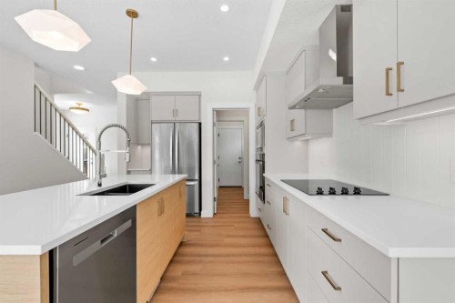 305 Precedence View, Cochrane, AB - Indoor Photo Showing Kitchen With Upgraded Kitchen