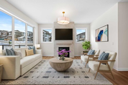 305 Precedence View, Cochrane, AB - Indoor Photo Showing Living Room With Fireplace
