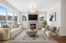 305 Precedence View, Cochrane, AB  - Indoor Photo Showing Living Room With Fireplace 