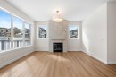 305 Precedence View, Cochrane, AB  - Indoor Photo Showing Living Room With Fireplace 
