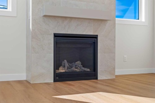 305 Precedence View, Cochrane, AB - Indoor Photo Showing Living Room With Fireplace