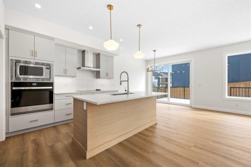 305 Precedence View, Cochrane, AB - Indoor Photo Showing Kitchen With Upgraded Kitchen
