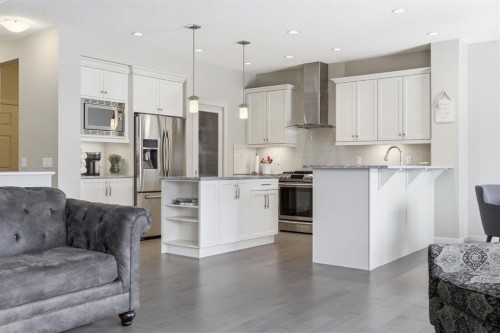 132 Sundown Way, Cochrane, AB - Indoor Photo Showing Kitchen With Stainless Steel Kitchen With Upgraded Kitchen