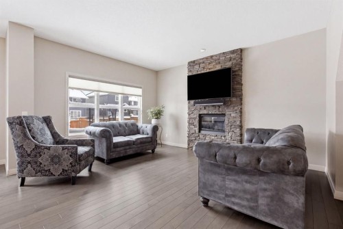 132 Sundown Way, Cochrane, AB - Indoor Photo Showing Living Room With Fireplace
