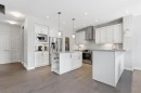 132 Sundown Way, Cochrane, AB  - Indoor Photo Showing Kitchen With Upgraded Kitchen 