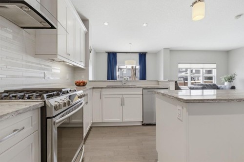 132 Sundown Way, Cochrane, AB - Indoor Photo Showing Kitchen With Upgraded Kitchen