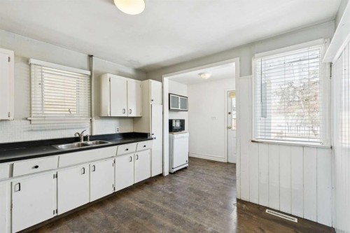 8312 47 Avenue Nw, Calgary, AB - Indoor Photo Showing Kitchen With Double Sink