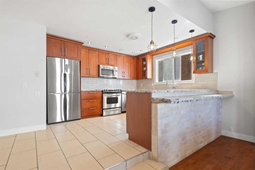 208 Woodpark Place Sw, Calgary, AB - Indoor Photo Showing Kitchen With Stainless Steel Kitchen