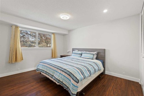 208 Woodpark Place Sw, Calgary, AB - Indoor Photo Showing Bedroom