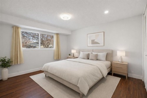 208 Woodpark Place Sw, Calgary, AB - Indoor Photo Showing Bedroom