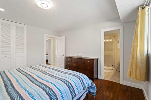 208 Woodpark Place Sw, Calgary, AB - Indoor Photo Showing Bedroom