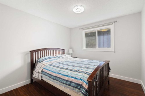 208 Woodpark Place Sw, Calgary, AB - Indoor Photo Showing Bedroom
