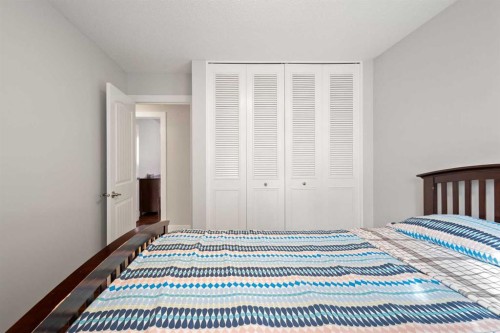 208 Woodpark Place Sw, Calgary, AB - Indoor Photo Showing Bedroom