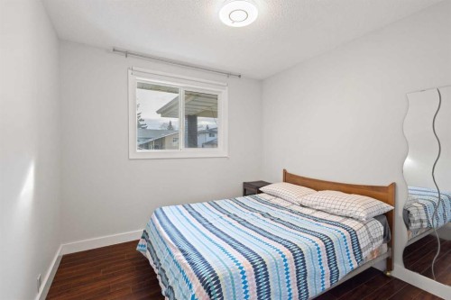 208 Woodpark Place Sw, Calgary, AB - Indoor Photo Showing Bedroom