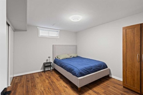 208 Woodpark Place Sw, Calgary, AB - Indoor Photo Showing Bedroom