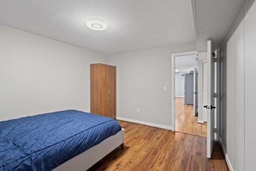 208 Woodpark Place Sw, Calgary, AB - Indoor Photo Showing Bedroom