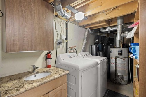 208 Woodpark Place Sw, Calgary, AB - Indoor Photo Showing Laundry Room