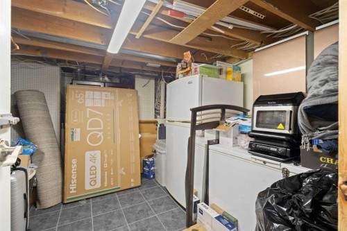 208 Woodpark Place Sw, Calgary, AB - Indoor Photo Showing Basement