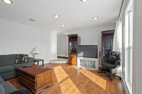 208 Woodpark Place Sw, Calgary, AB - Indoor Photo Showing Living Room With Fireplace