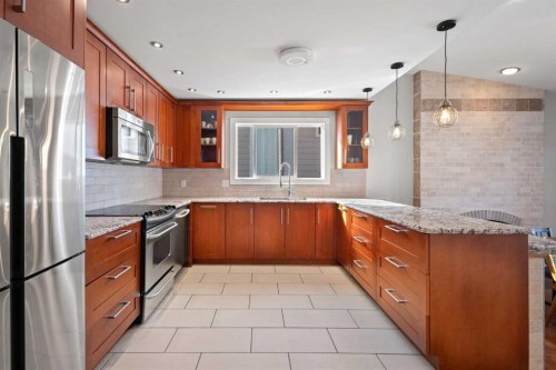208 Woodpark Place Sw, Calgary, AB - Indoor Photo Showing Kitchen With Stainless Steel Kitchen With Upgraded Kitchen
