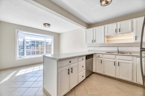 32 Midpark Drive Se, Calgary, AB - Indoor Photo Showing Kitchen With Double Sink