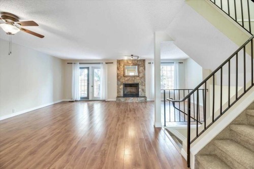 32 Midpark Drive Se, Calgary, AB - Indoor Photo Showing Living Room With Fireplace