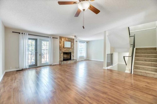 32 Midpark Drive Se, Calgary, AB - Indoor Photo Showing Living Room With Fireplace