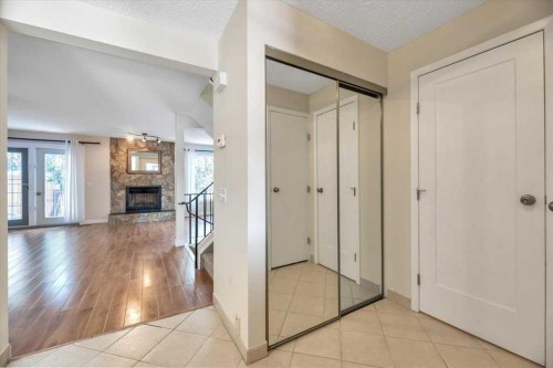 32 Midpark Drive Se, Calgary, AB - Indoor Photo Showing Other Room With Fireplace