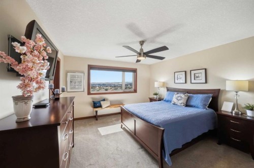 185 Sunset Circle, Cochrane, AB - Indoor Photo Showing Bedroom