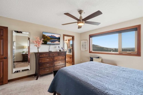 185 Sunset Circle, Cochrane, AB - Indoor Photo Showing Bedroom