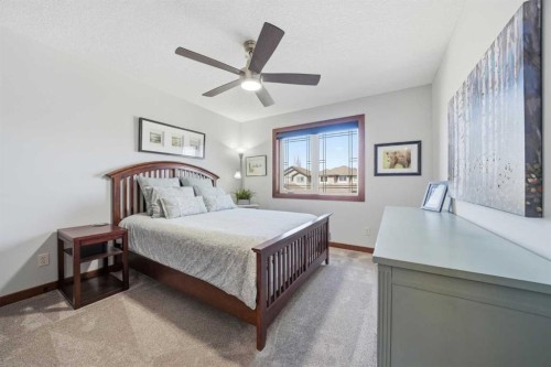 185 Sunset Circle, Cochrane, AB - Indoor Photo Showing Bedroom