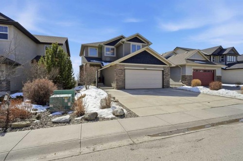 185 Sunset Circle, Cochrane, AB - Outdoor With Facade
