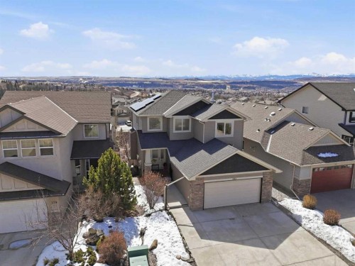 185 Sunset Circle, Cochrane, AB - Outdoor With Facade