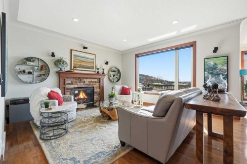 185 Sunset Circle, Cochrane, AB - Indoor Photo Showing Living Room With Fireplace