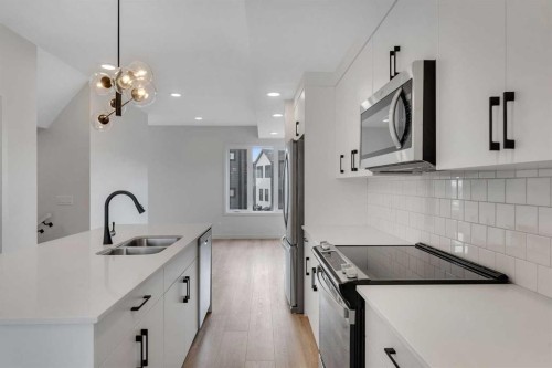 804A-120 Arbour Lake Court Nw, Calgary, AB - Indoor Photo Showing Kitchen With Double Sink With Upgraded Kitchen