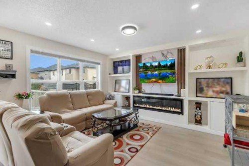 16 Saddletree Close Ne, Calgary, AB - Indoor Photo Showing Living Room With Fireplace
