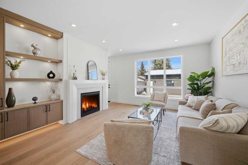 8140 47 Avenue Nw, Calgary, AB - Indoor Photo Showing Living Room With Fireplace