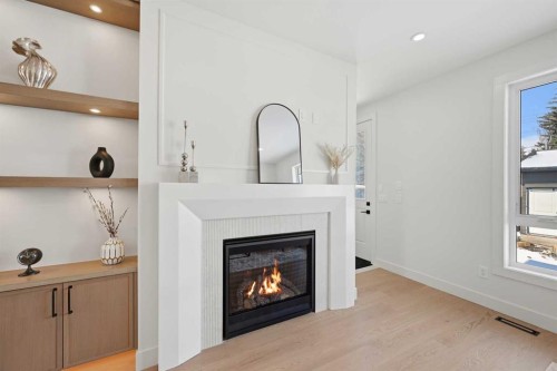 8140 47 Avenue Nw, Calgary, AB - Indoor Photo Showing Living Room With Fireplace
